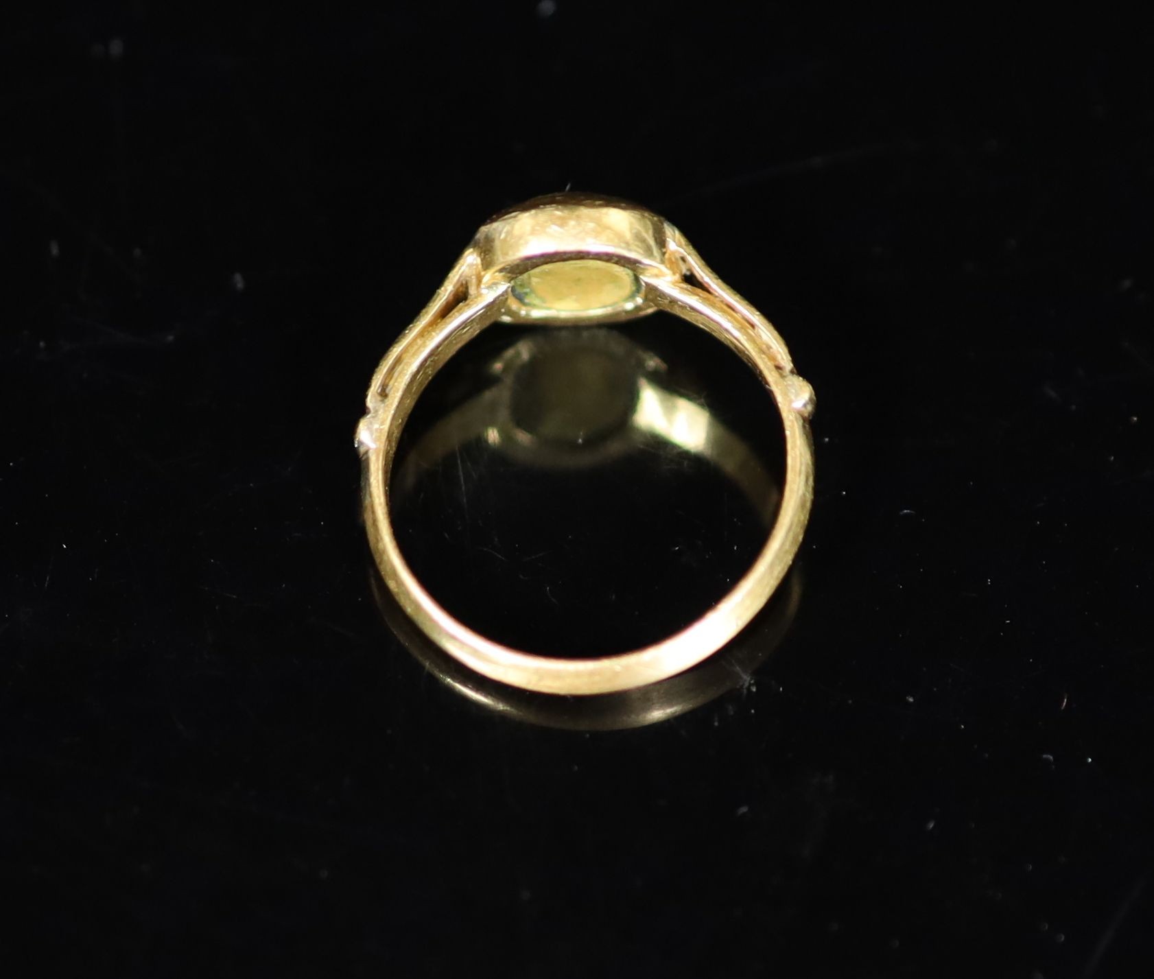 An antique gold ring, the centre now with gold? (ex gemstone) insert